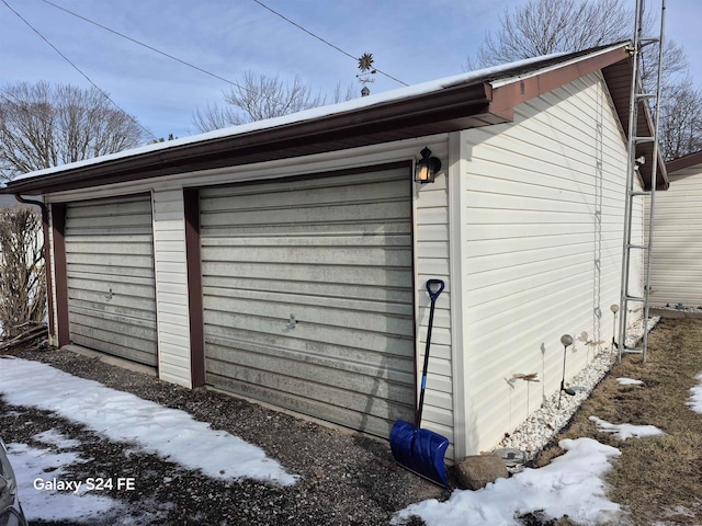 view of snow covered garage