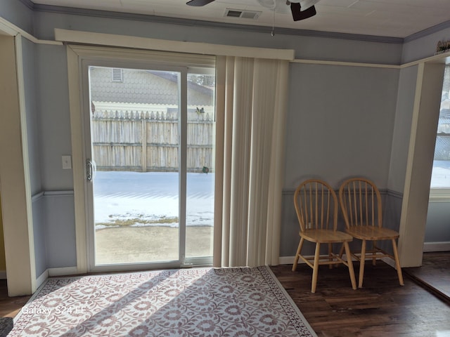 dining area with ceiling fan, wood-type flooring, and ornamental molding