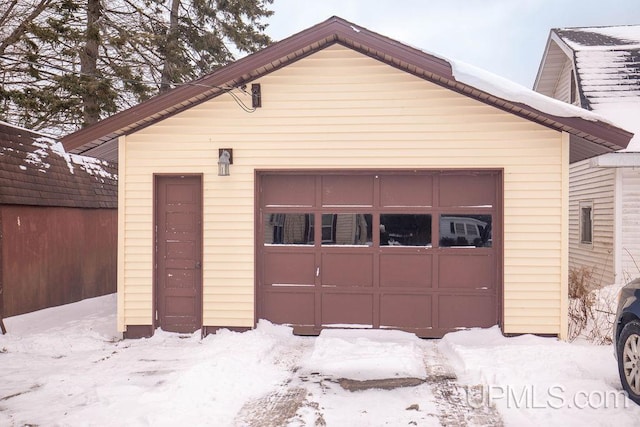 view of snow covered garage