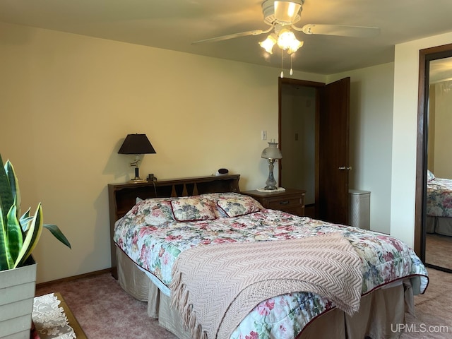 bedroom with carpet floors and a ceiling fan