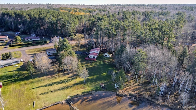 birds eye view of property with a forest view