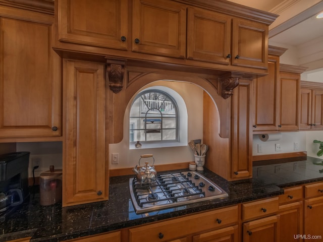 kitchen featuring stainless steel gas stovetop and brown cabinets