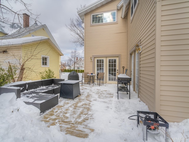 snow covered patio with fence