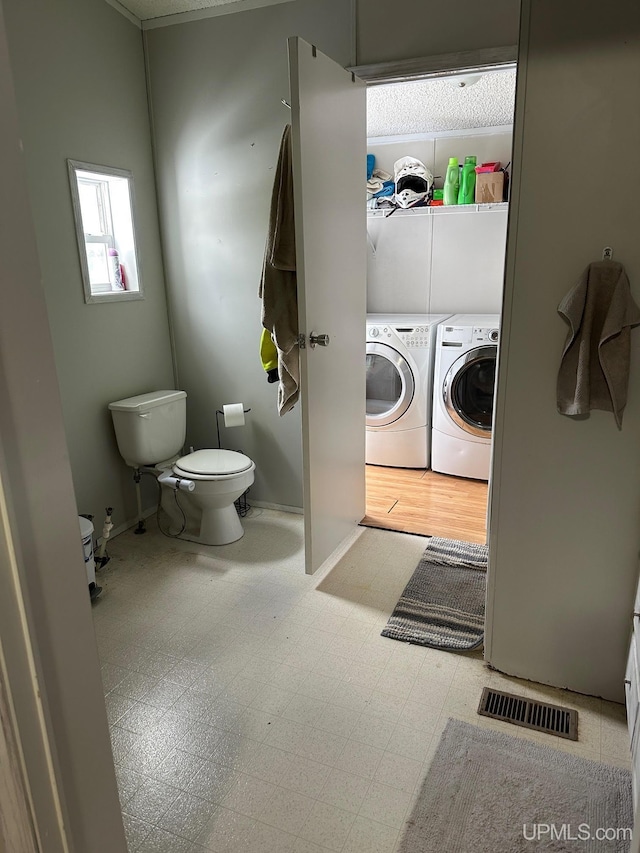 laundry room featuring washing machine and dryer