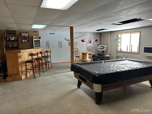 recreation room featuring heating unit, pool table, a drop ceiling, and bar area