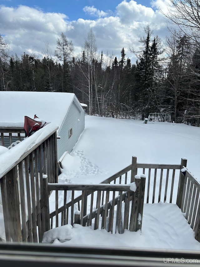 view of snow covered deck