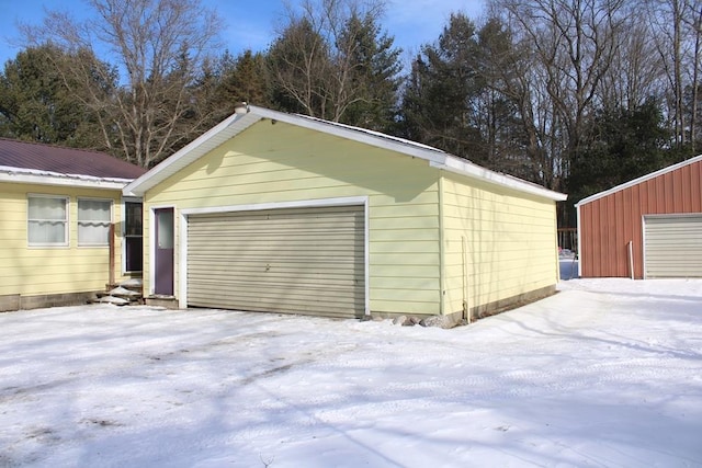 view of snow covered garage