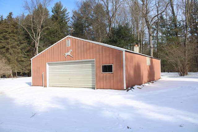 view of snow covered garage