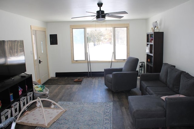 living room featuring dark wood-type flooring and ceiling fan