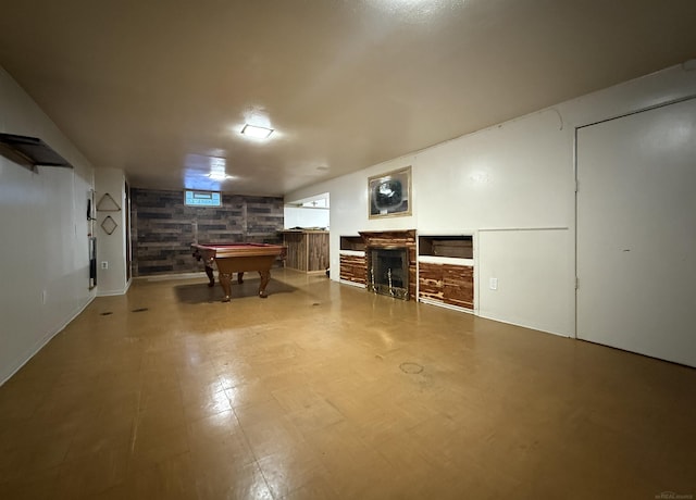 basement with billiards and a fireplace