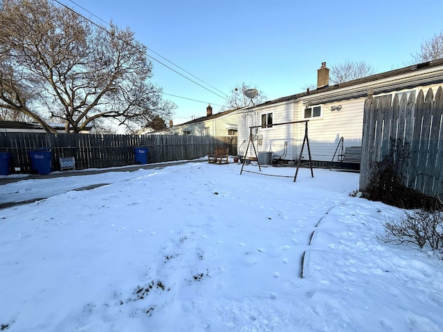 view of yard covered in snow