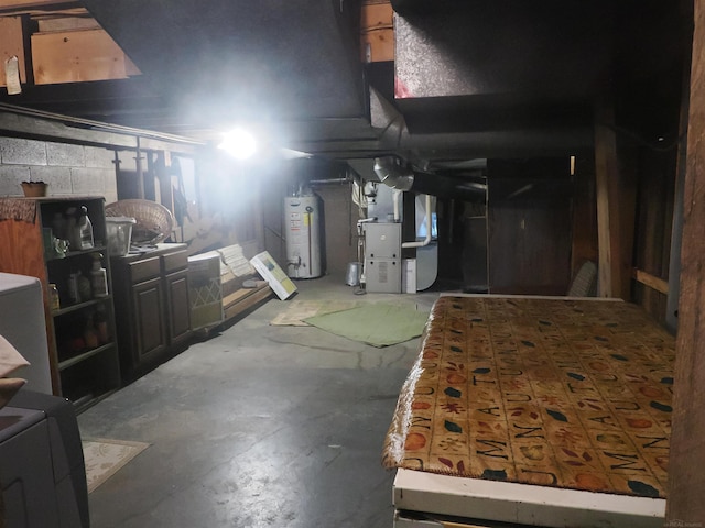 unfinished basement featuring heating unit and gas water heater