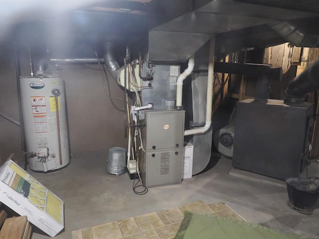 utility room featuring water heater and heating unit