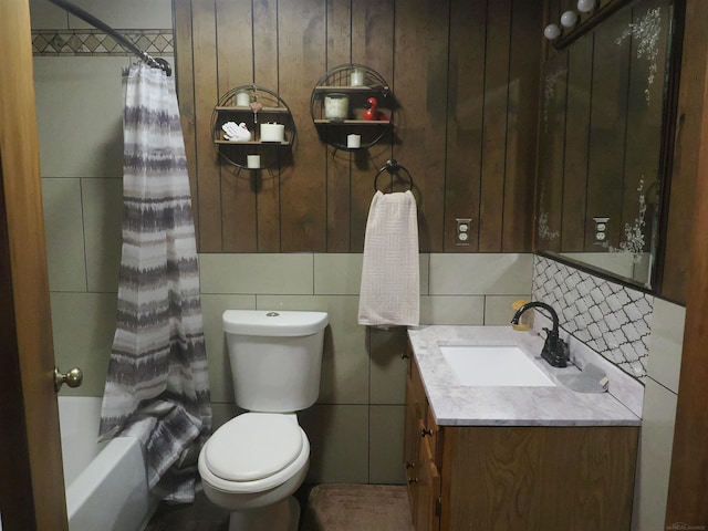 bathroom featuring vanity, tasteful backsplash, shower / bath combo with shower curtain, and toilet