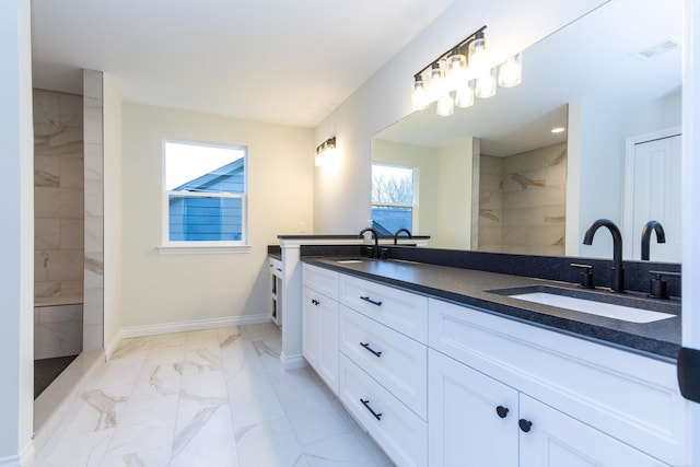 bathroom featuring vanity and a tile shower