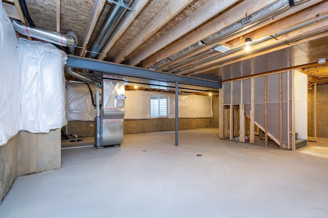 basement featuring heating unit