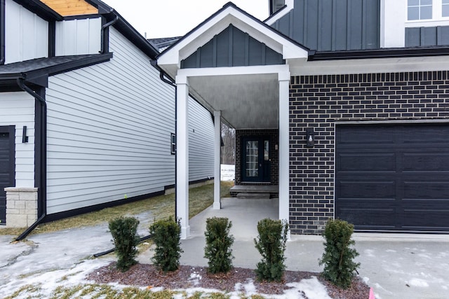 view of exterior entry with a garage