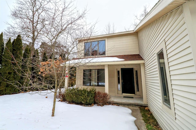 view of snow covered property entrance