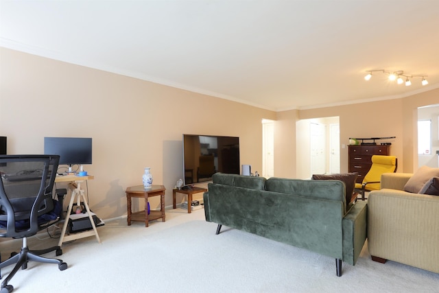 carpeted living room featuring crown molding and baseboards