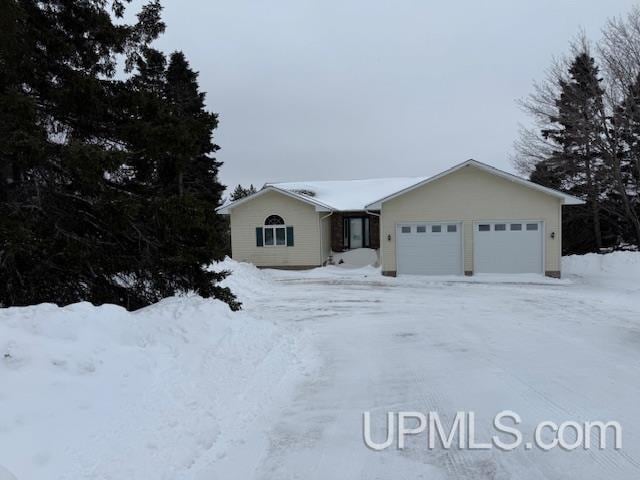 ranch-style house featuring an attached garage