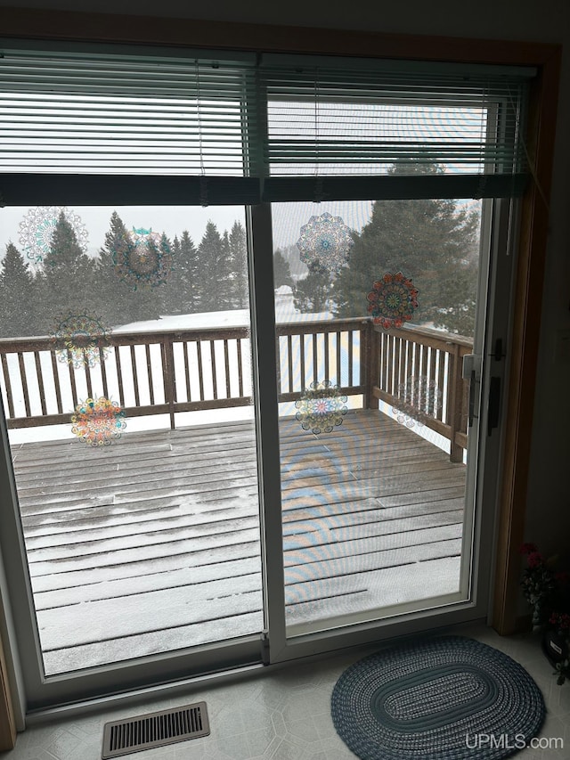 wooden deck featuring visible vents