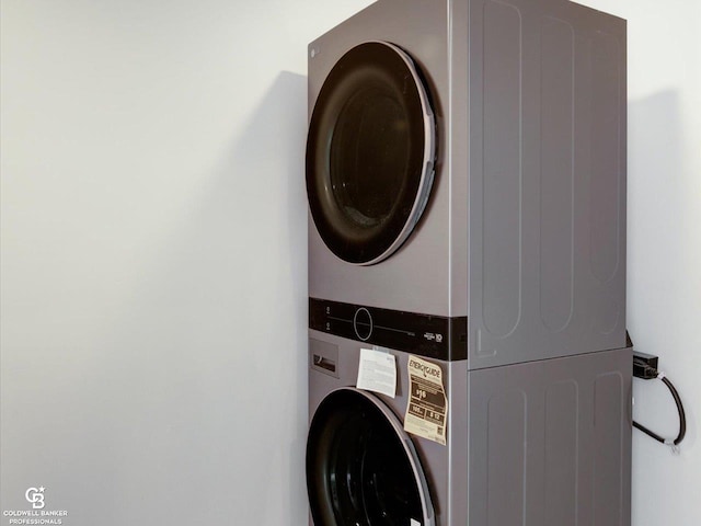 laundry area with stacked washer and dryer