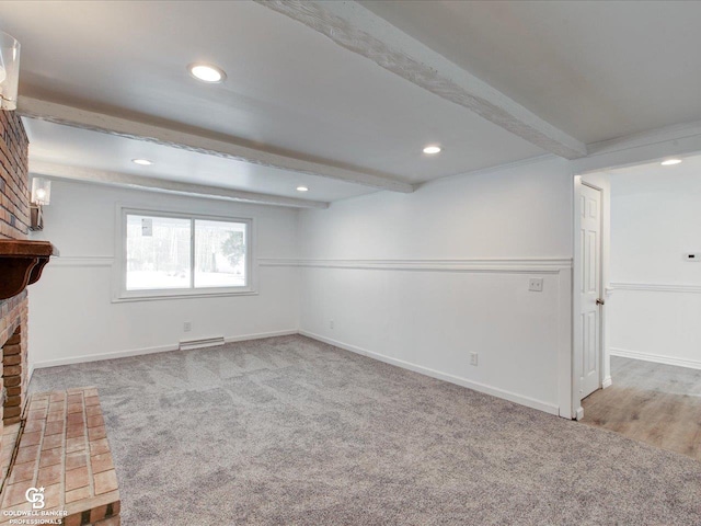 basement featuring a fireplace and carpet flooring