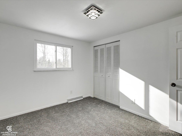 unfurnished bedroom with a closet and carpet