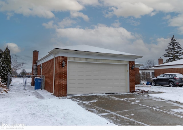 view of snow covered garage