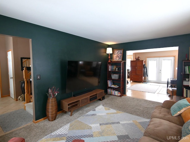 living room with light colored carpet and french doors