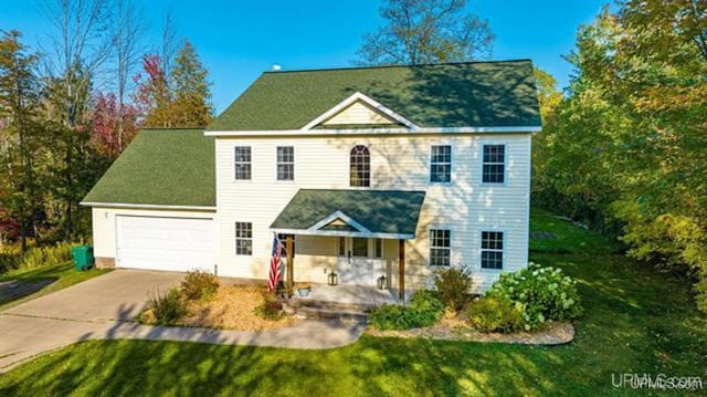 view of front of house featuring a front yard and covered porch