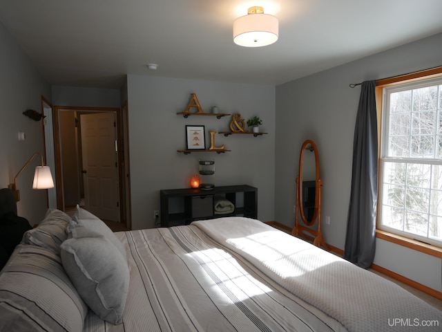 bedroom featuring multiple windows