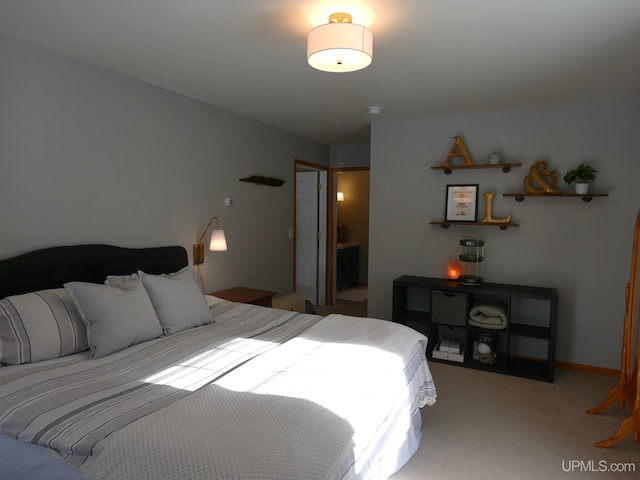 bedroom featuring light carpet