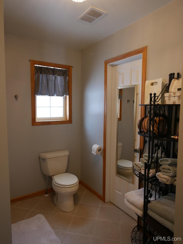 bathroom featuring tile patterned floors and toilet