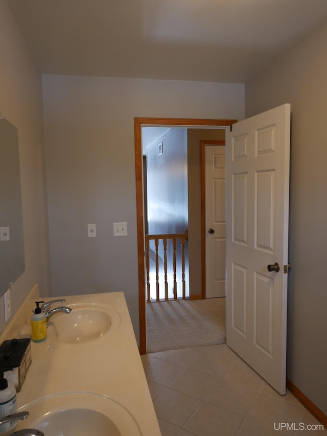 bathroom featuring tile patterned flooring and sink