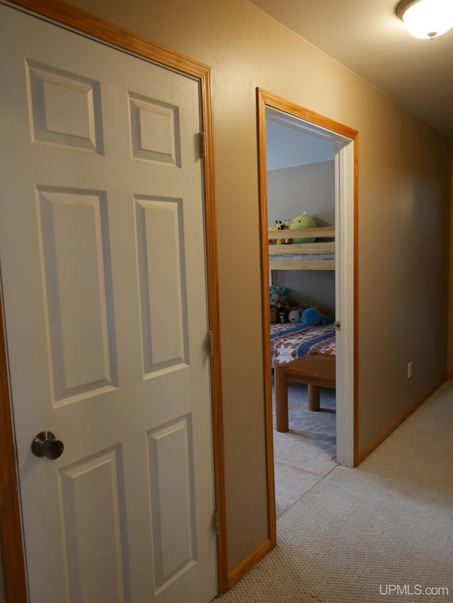 corridor with light colored carpet