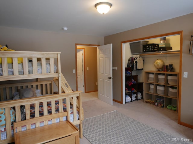 carpeted bedroom with a closet