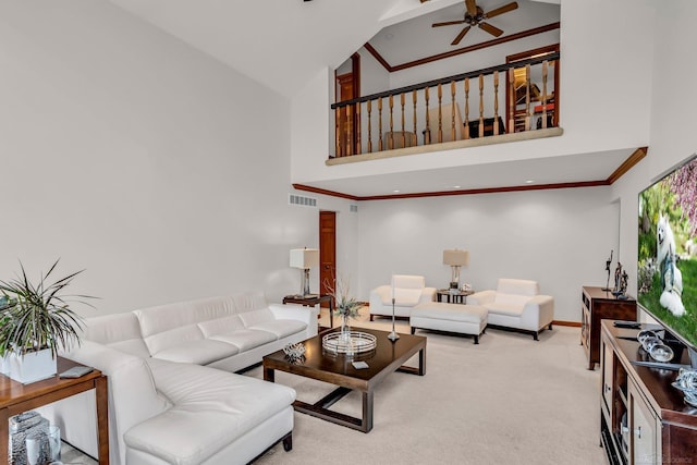 living room with high vaulted ceiling, ornamental molding, light colored carpet, and ceiling fan