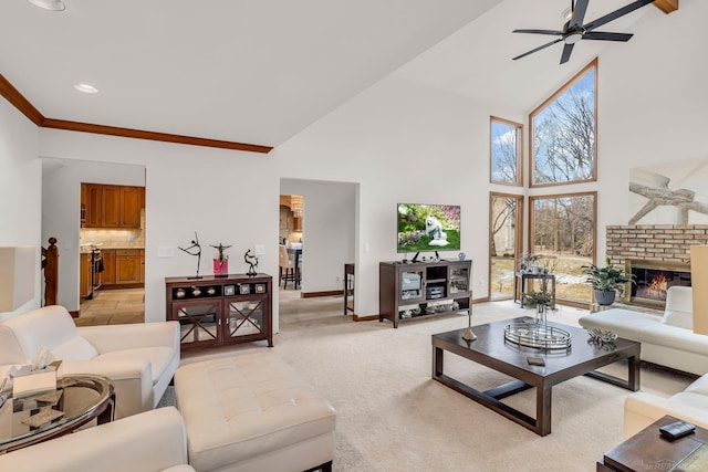 carpeted living room with ceiling fan, high vaulted ceiling, and a fireplace