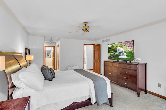 carpeted bedroom featuring crown molding, ceiling fan, and ensuite bathroom