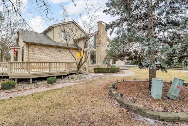 exterior space with a lawn and a deck