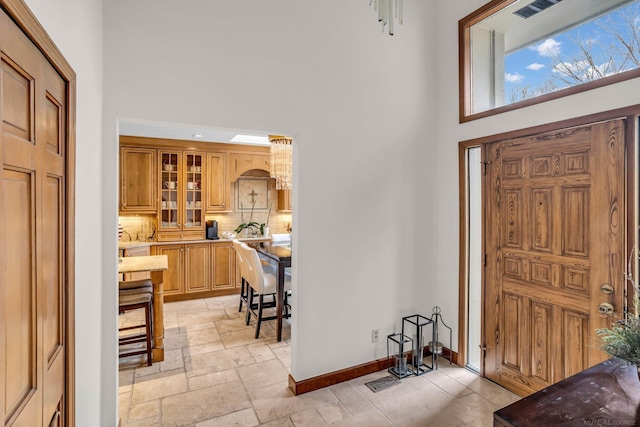 entrance foyer featuring a towering ceiling