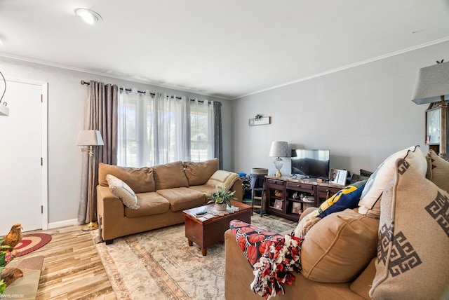 living room featuring crown molding and light wood-type flooring