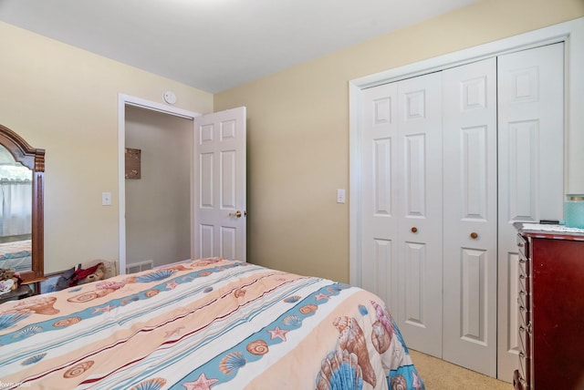 carpeted bedroom featuring a closet