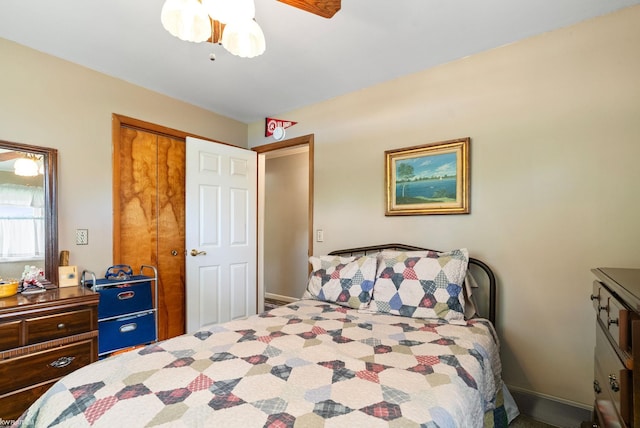 bedroom with ceiling fan and a closet