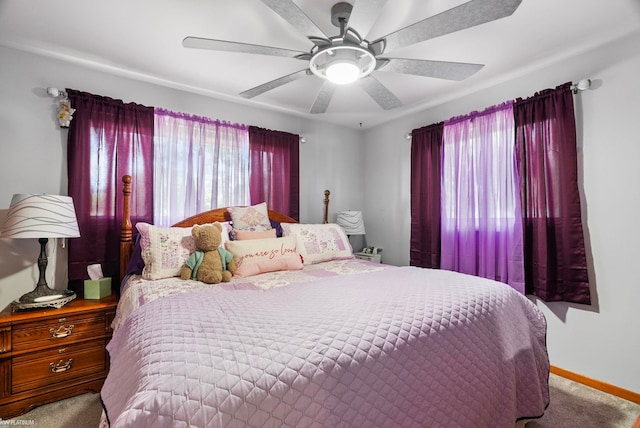 bedroom with light colored carpet and ceiling fan