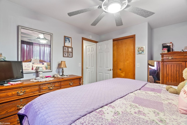 bedroom with ceiling fan and a closet