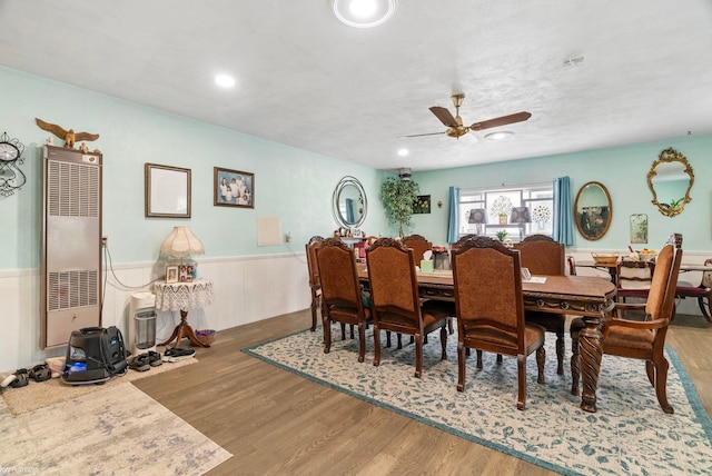 dining area featuring ceiling fan and hardwood / wood-style floors