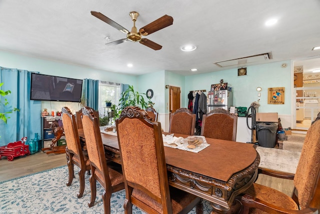 dining area featuring hardwood / wood-style floors and ceiling fan