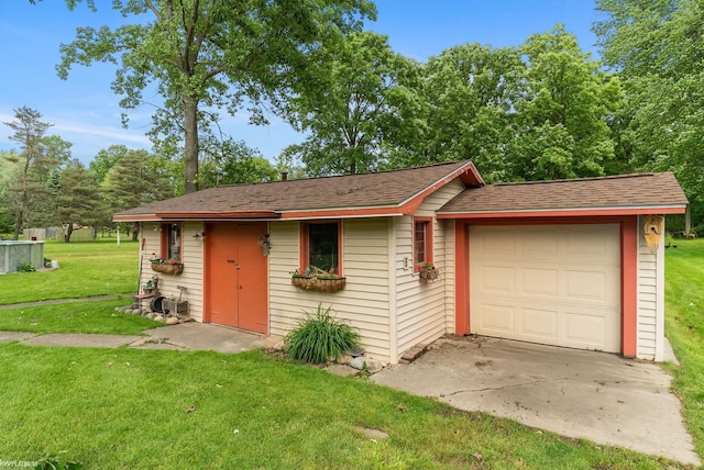 garage featuring a yard